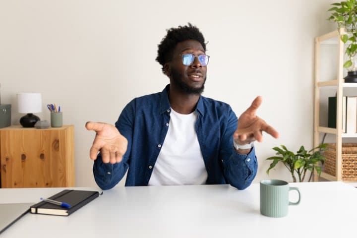 Young African American man on a video call. Black male on online business meeting.