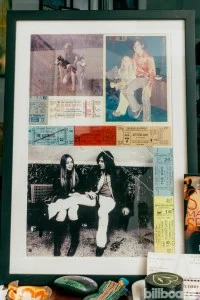 Kurfirst’s mother, Phyllis, created this framed collage that, in addition to ticket stubs from concerts that Gary promoted, depicts (clockwise from top) Phyllis and her pet huskies; Gary and Phyllis at his parents’ house; and at their alma mater, Forest Hills High School.