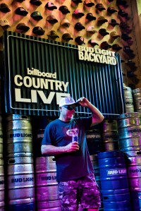 Billboard Country Live attendee posing in front of Bud Light photo moment