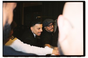 Alejandro (left) with his stage manager Orlando backstage at Kaseya Center on May 30 in Miami.