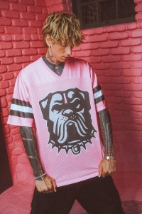 Machine Gun Kelly wearing a shirt from the collection he collaborated on with his hometown football team, the Cleveland Browns, at the start of the current football season.