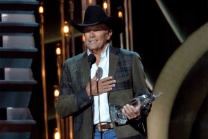 Entertainer of the Year winner George Strait speaks onstage during the 47th annual CMA Awards at the Bridgestone Arena on November 6, 2013 in Nashville, Tennessee.  (Photo by Rick Diamond/Getty Images)