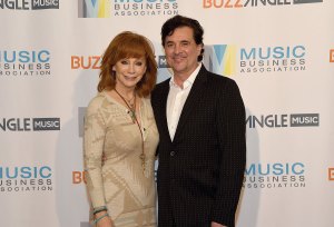 Reba McEntire and CEO of Big Machine Records Scott Borchetta attend the Music Biz 2017 Awards Luncheon sponsored by BuzzAngle Music at Renaissance Nashville Hotel on May 18, 2017 in Nashville, Tennessee.