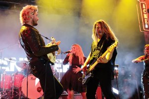 From left: Johnny Costello, Kimberly Perry and Reid Perry of The Band Perry perform onstage for the Big Machine 20th Anniversary concert at Lower Broadway on August 29, 2025 in Nashville, Tennessee.