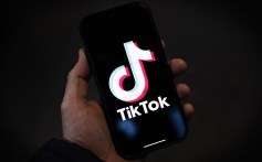In this photo illustration, a TikTok logo is displayed on an iPhone on February 28, 2023 in London, England.