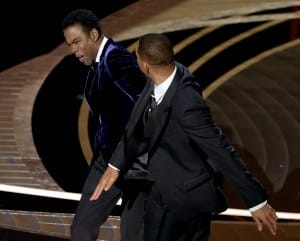 Will Smith appears to slap Chris Rock onstage during the 94th Annual Academy Awards at Dolby Theatre on March 27, 2022 in Hollywood, California.