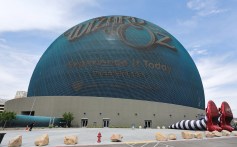 An exterior view shows an activation featuring 50-foot-long legs and 22-foot-tall ruby slippers of the Wicked Witch of the East character ahead of the premiere of 